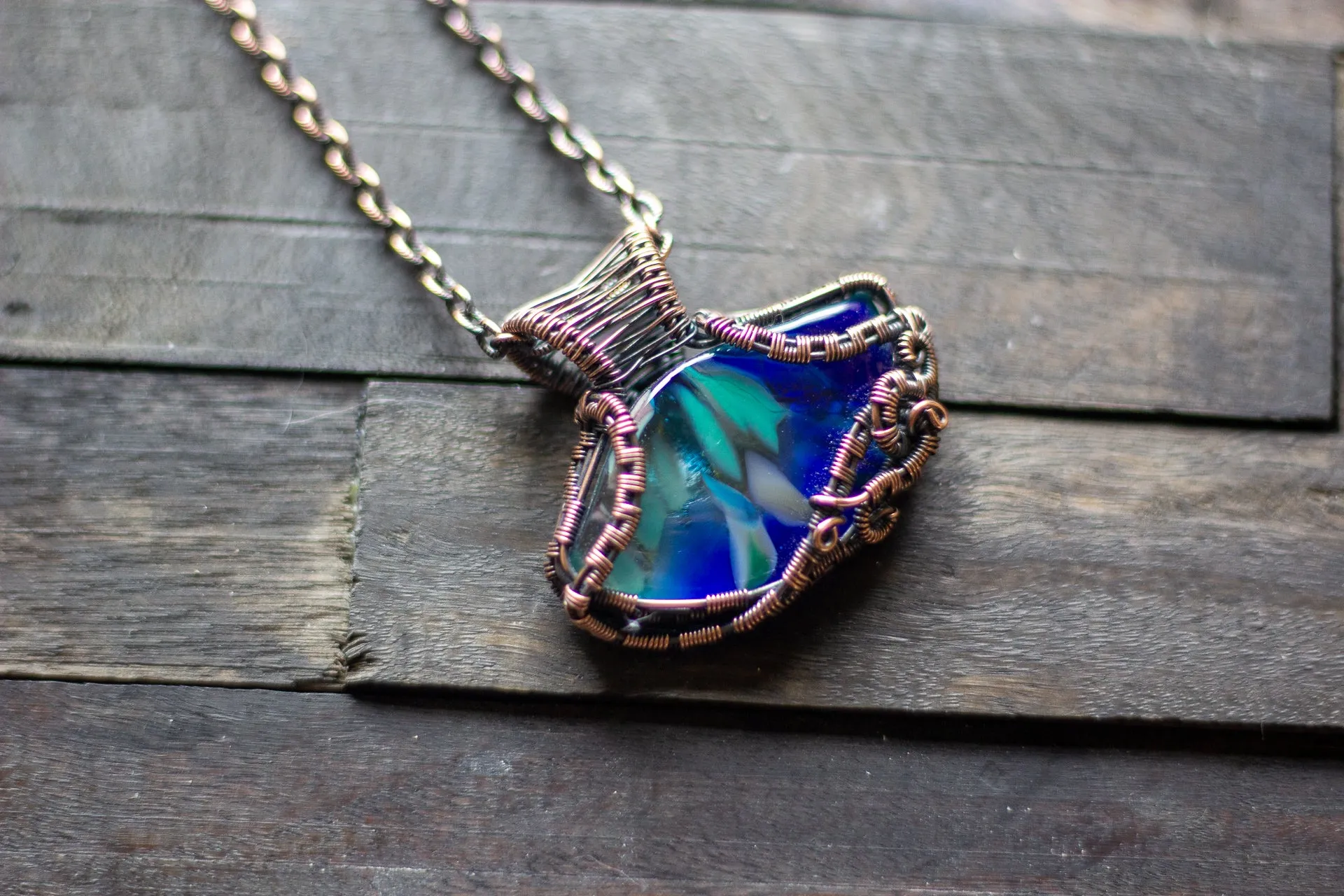 Streaks of Blue and Green Fused Glass Pendant with Copper Wire Wrapping