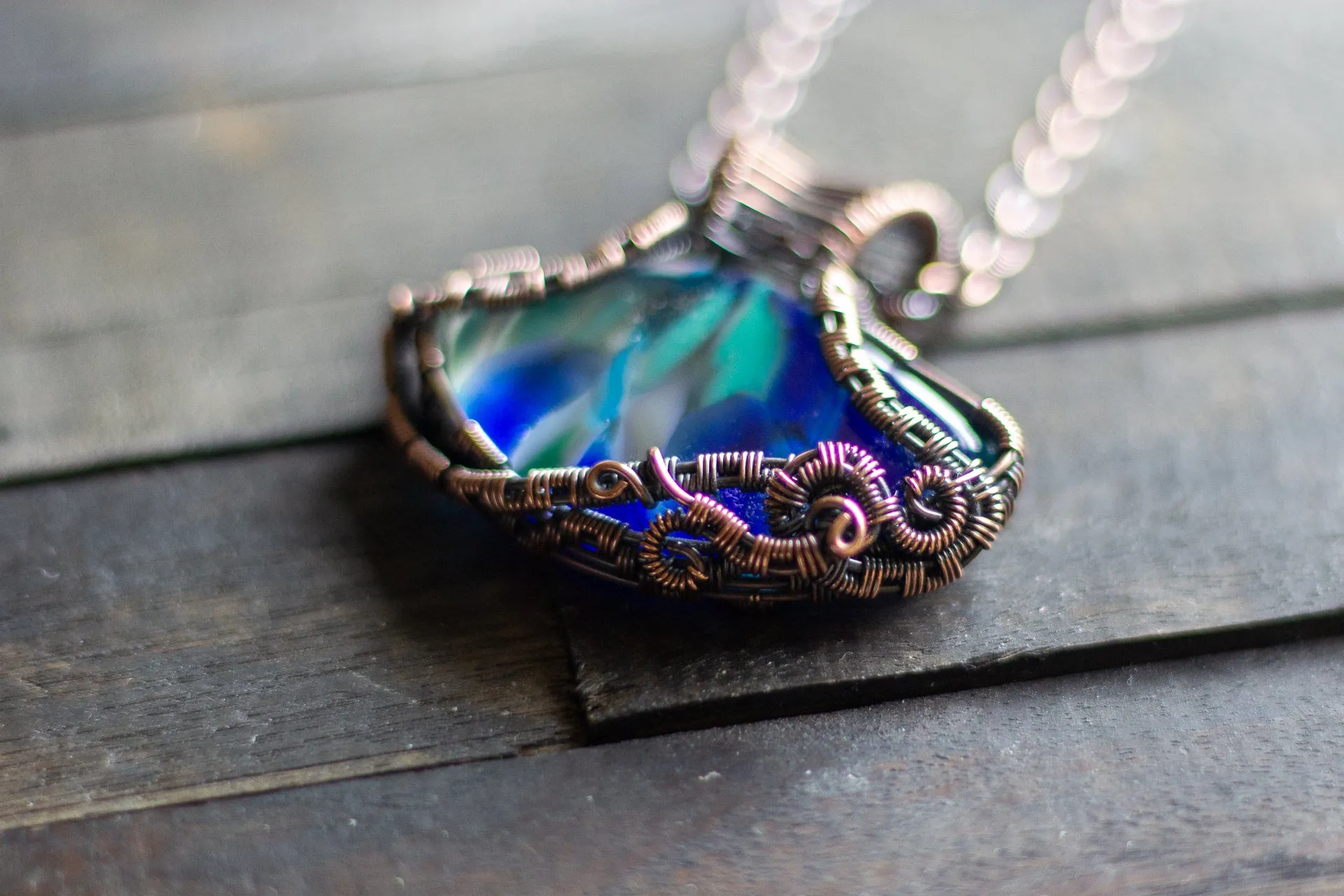 Streaks of Blue and Green Fused Glass Pendant with Copper Wire Wrapping